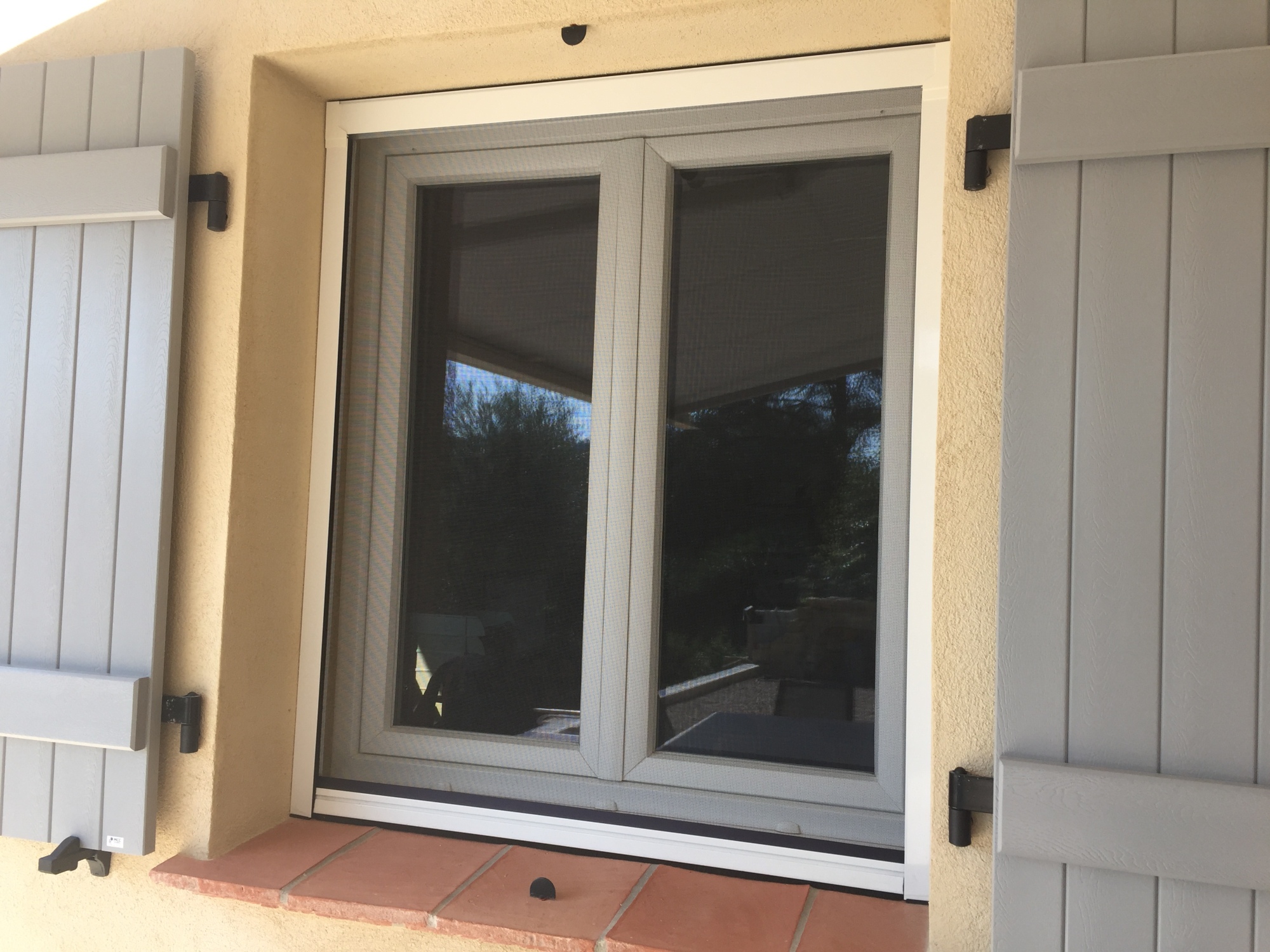 Moustiquaire enroulable verticale