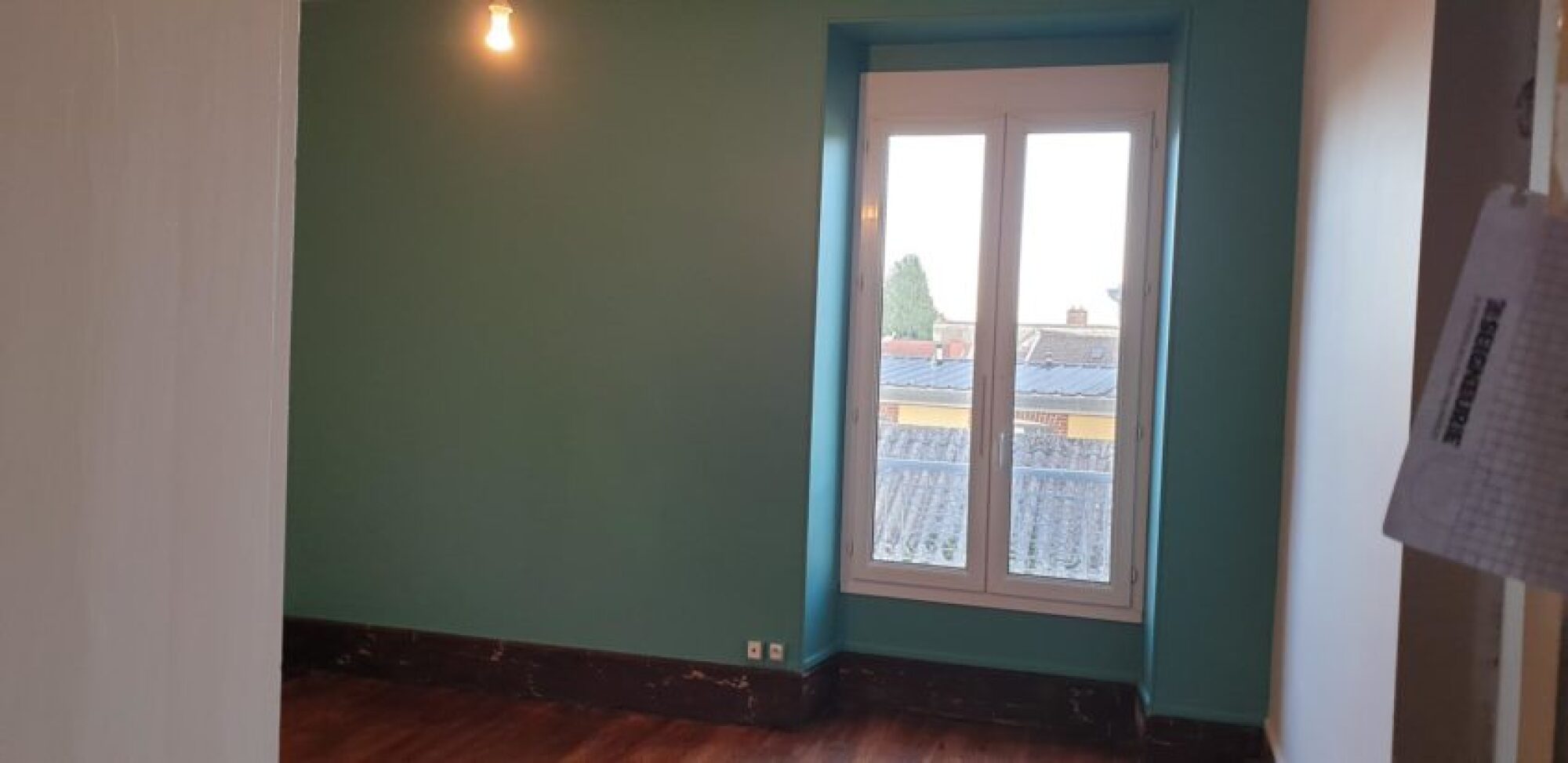 Pose de toiles de verre et mise en peinture