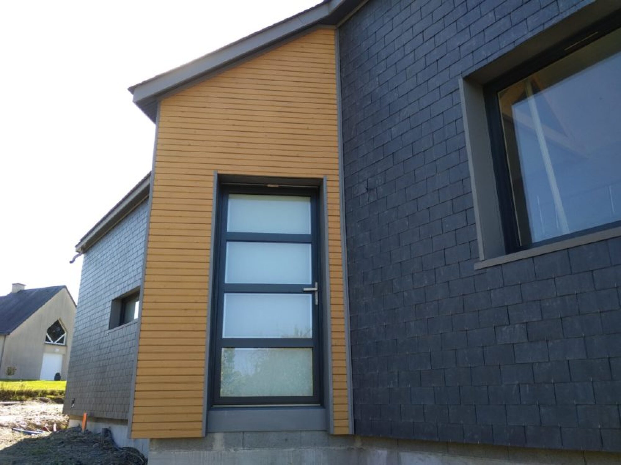 Installation bardage maison en ardoise, travaux façade