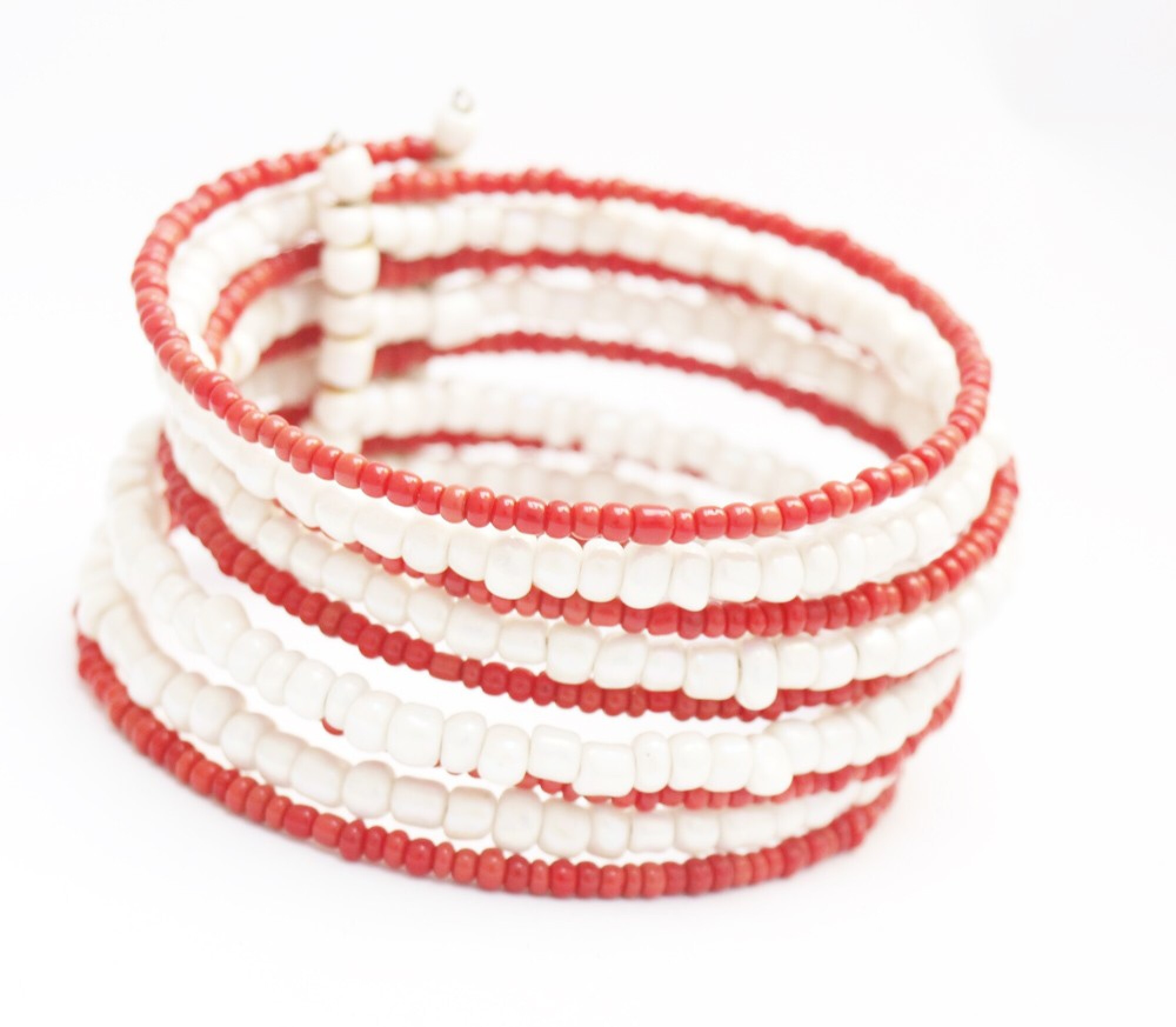 Bracelet rigide en perles oranges et blanches