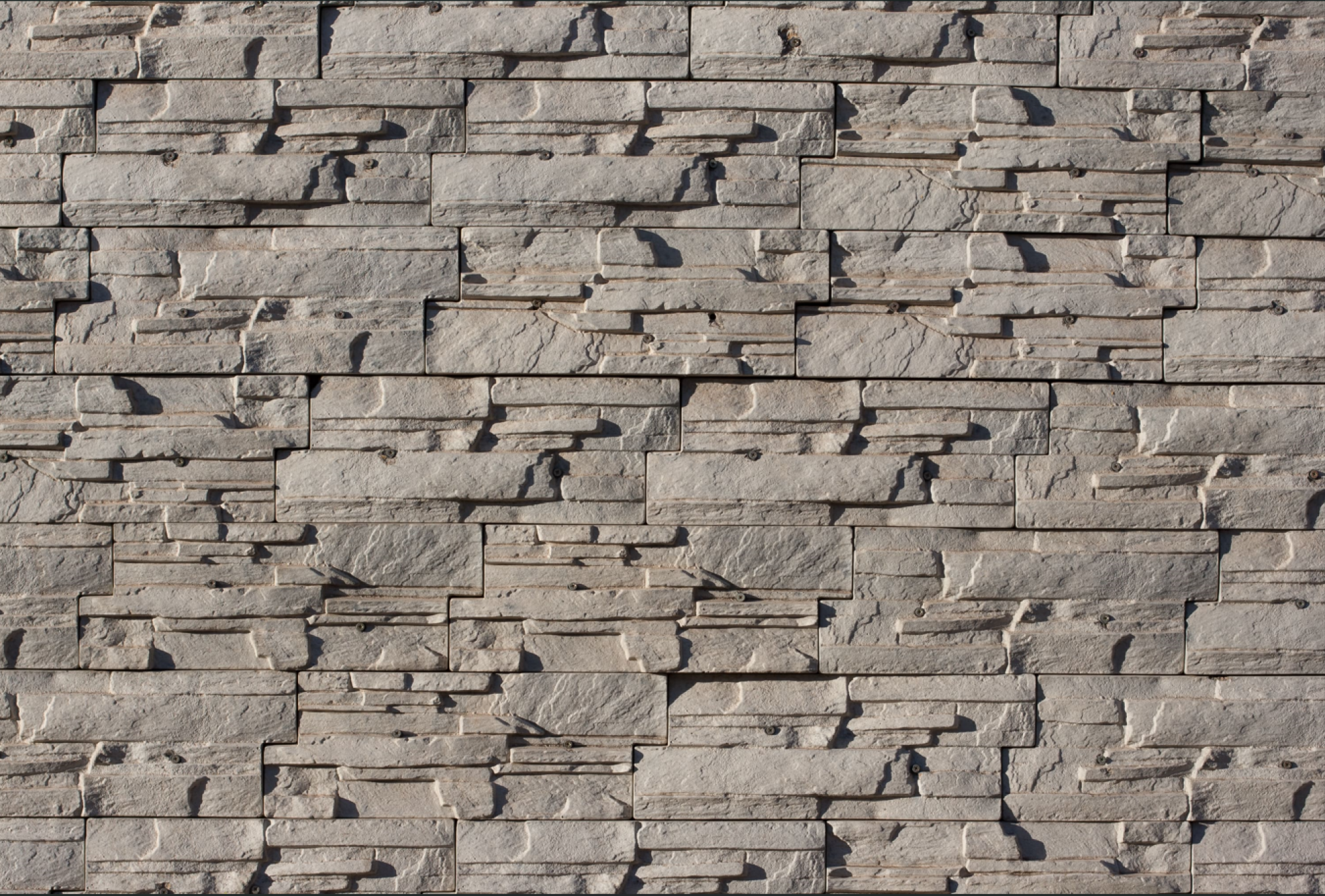 Pose de bardage pierre